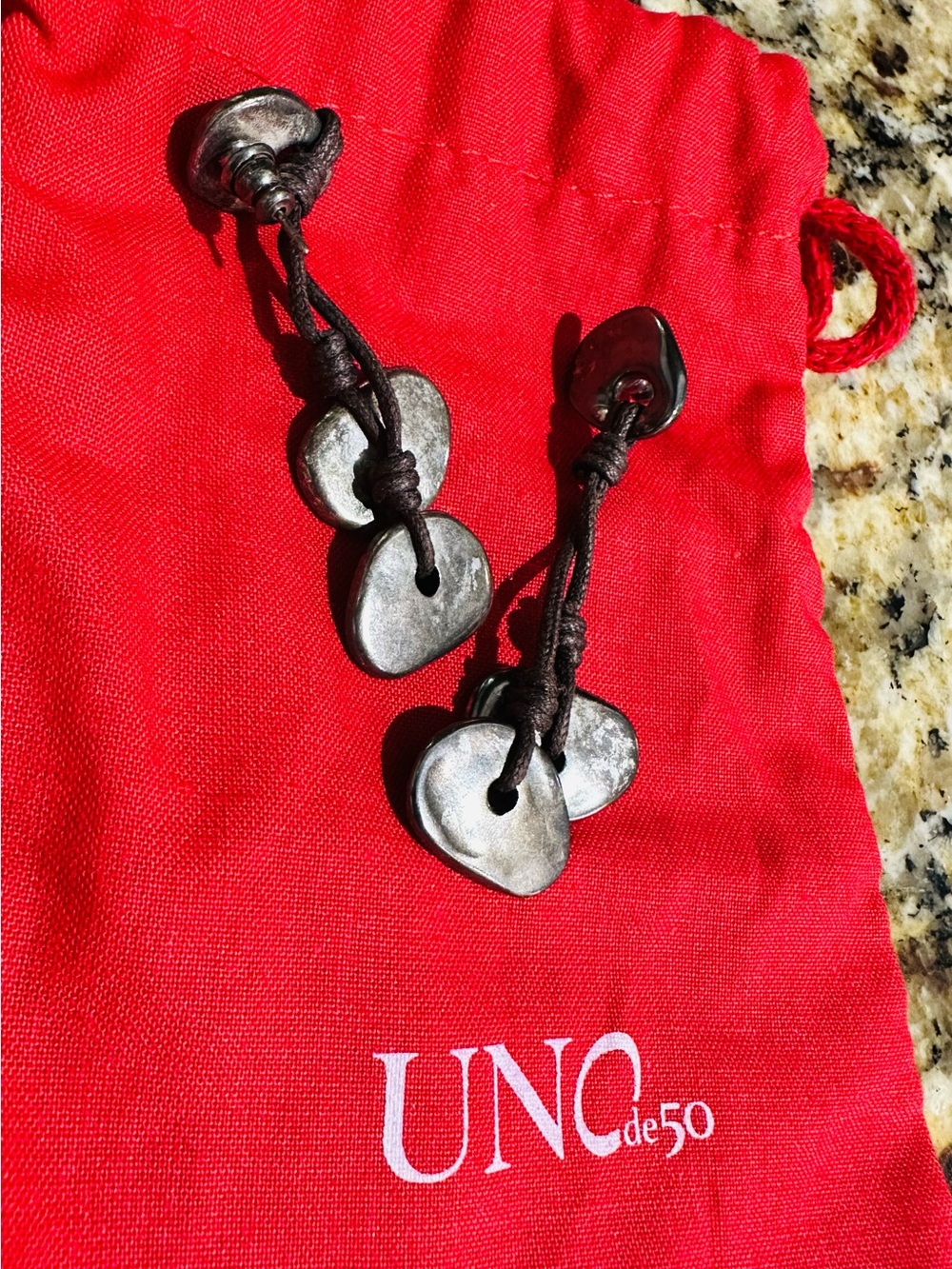 UNO de 50 Silver-Tone Hammered Heart Drop Earrings on Dark Cord